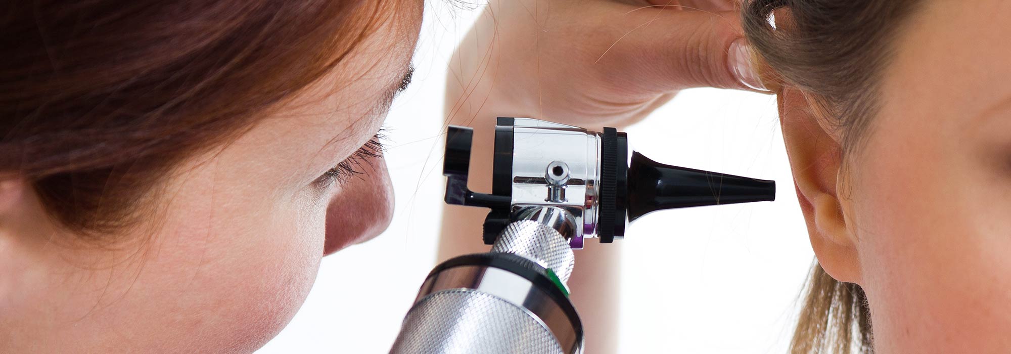 Doctor Checking Patient's Ear